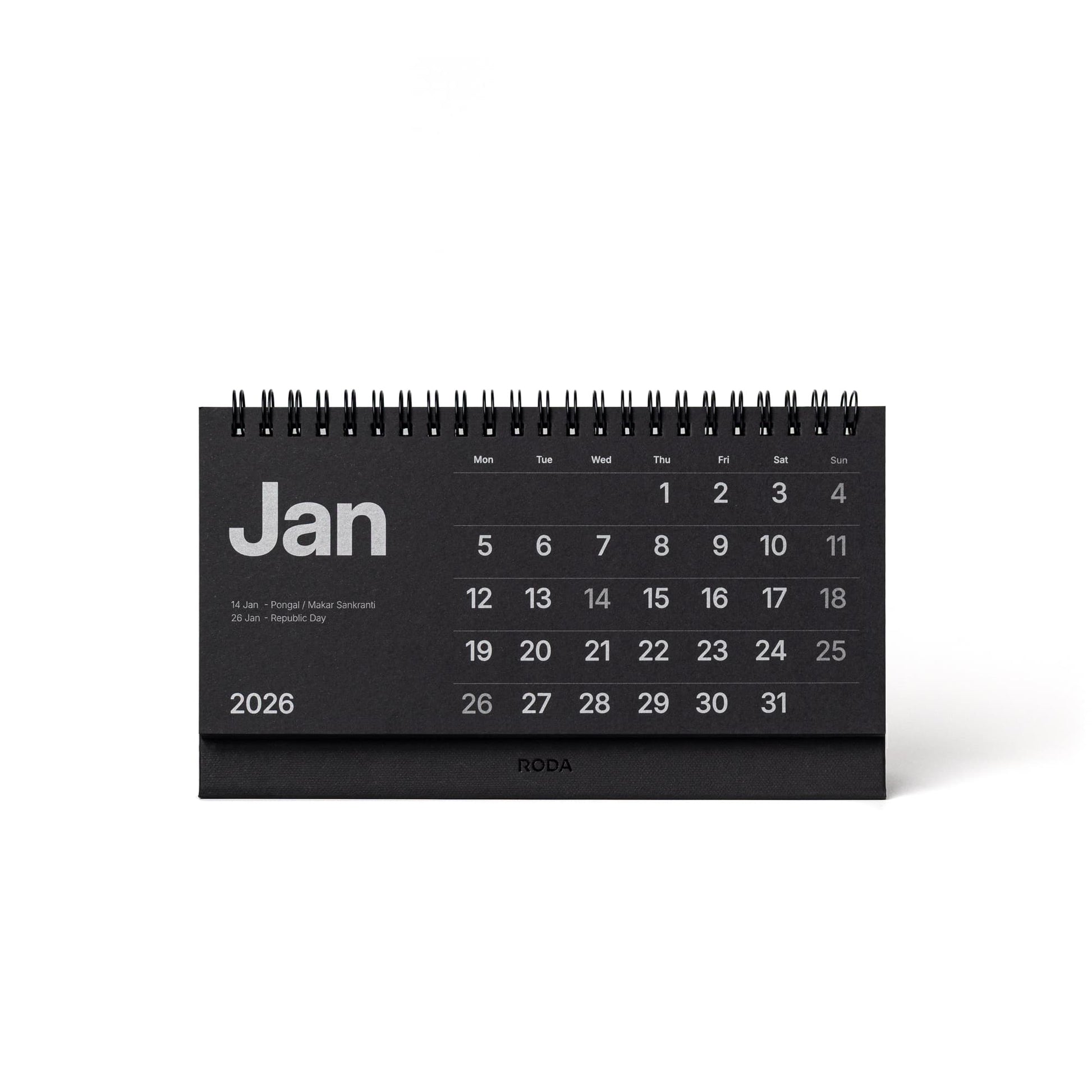 Black desk calendar for January 2026